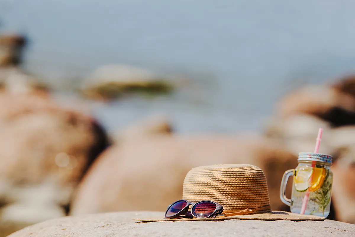 beutiful beach landscape with sunglasses hat