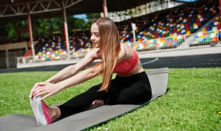 fitness sporty girl sportswear football stadium outdoor sports happy sexy woman workout yoga mat background green grass