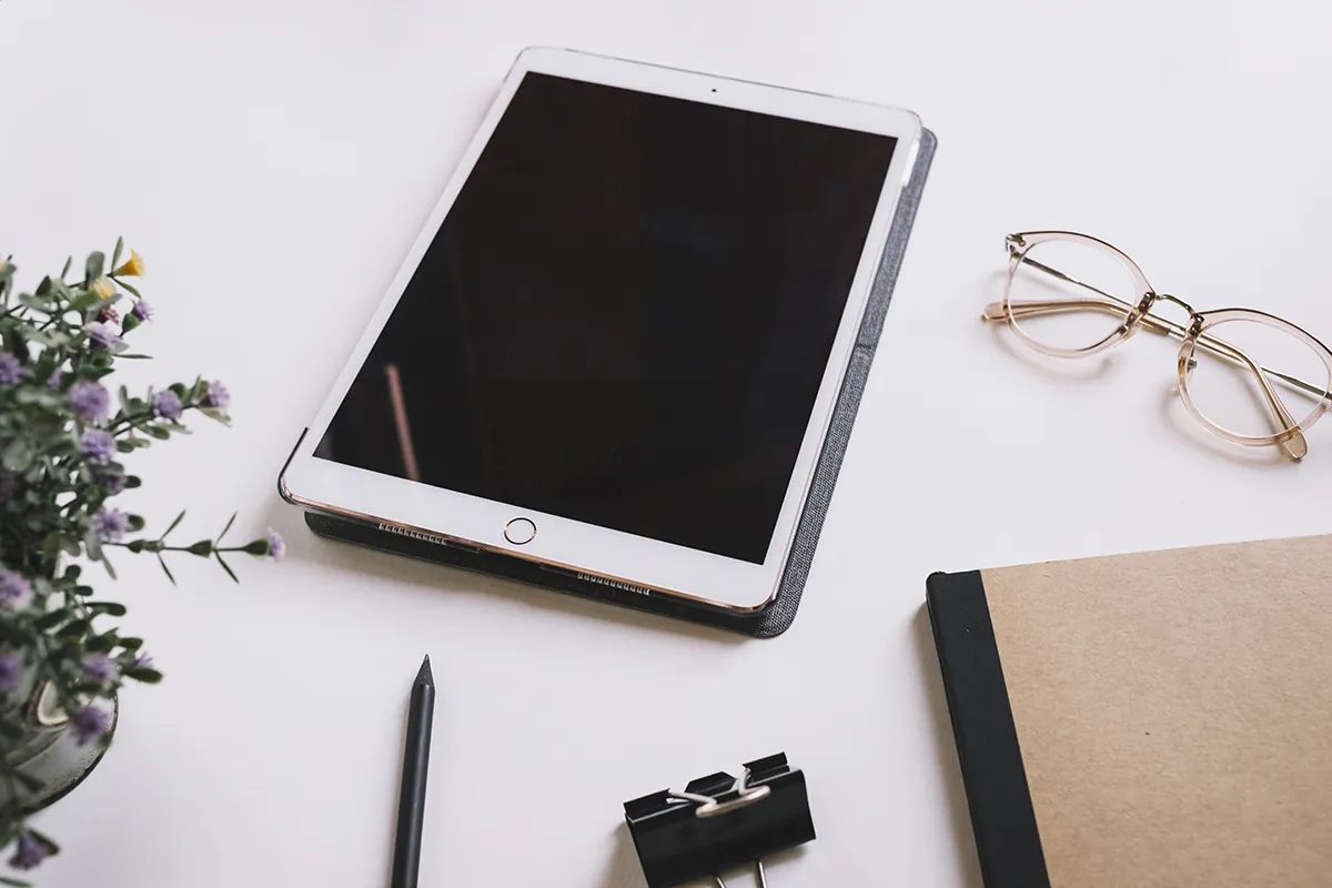 tablet glasses near stationery