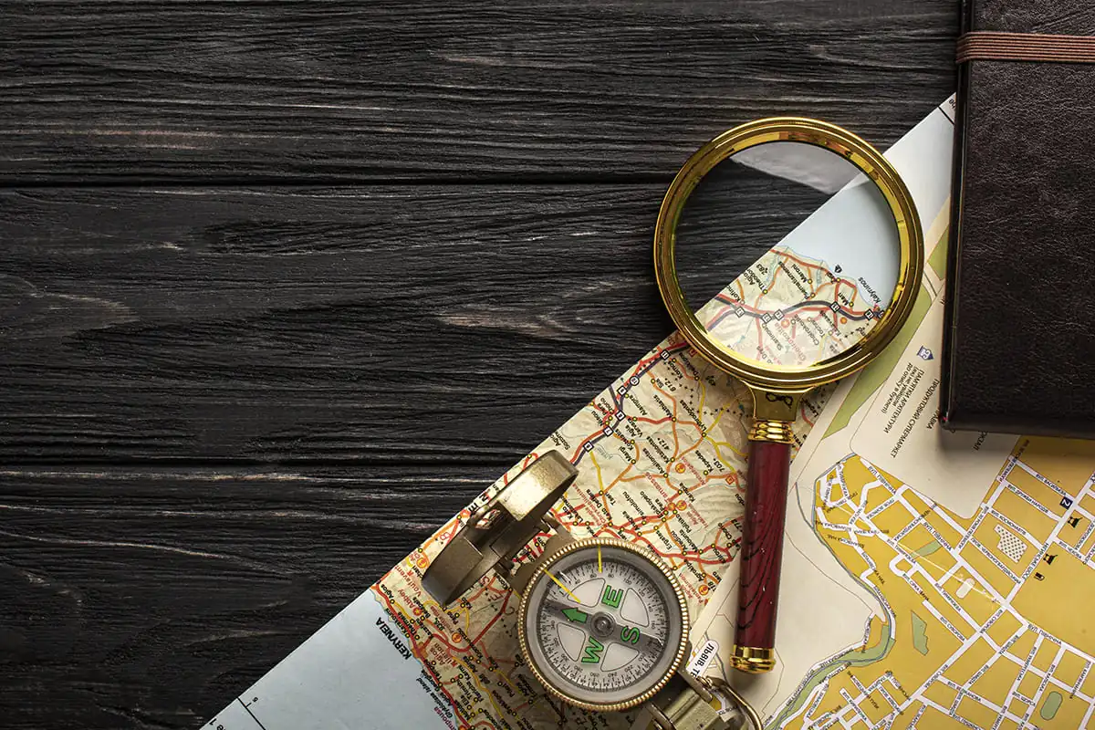 flat lay travel set with magnifying glass 1